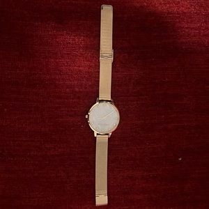 Lucky brand gold watch pearl face with Dina don rhinestones and gold band.
